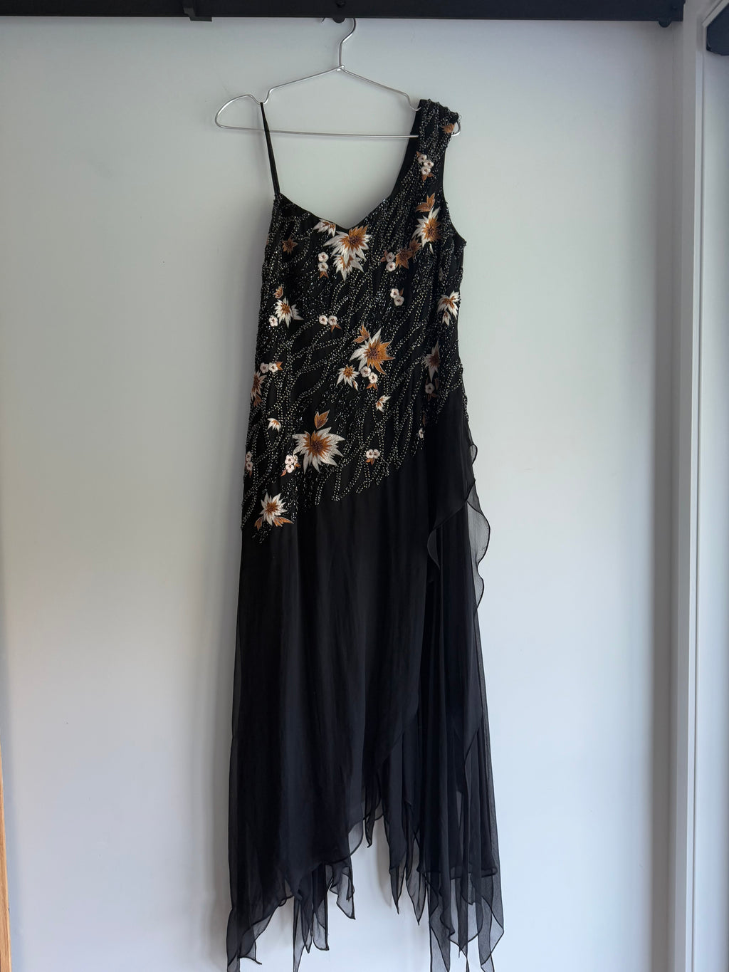 Evening gown with sequins and hanky hem