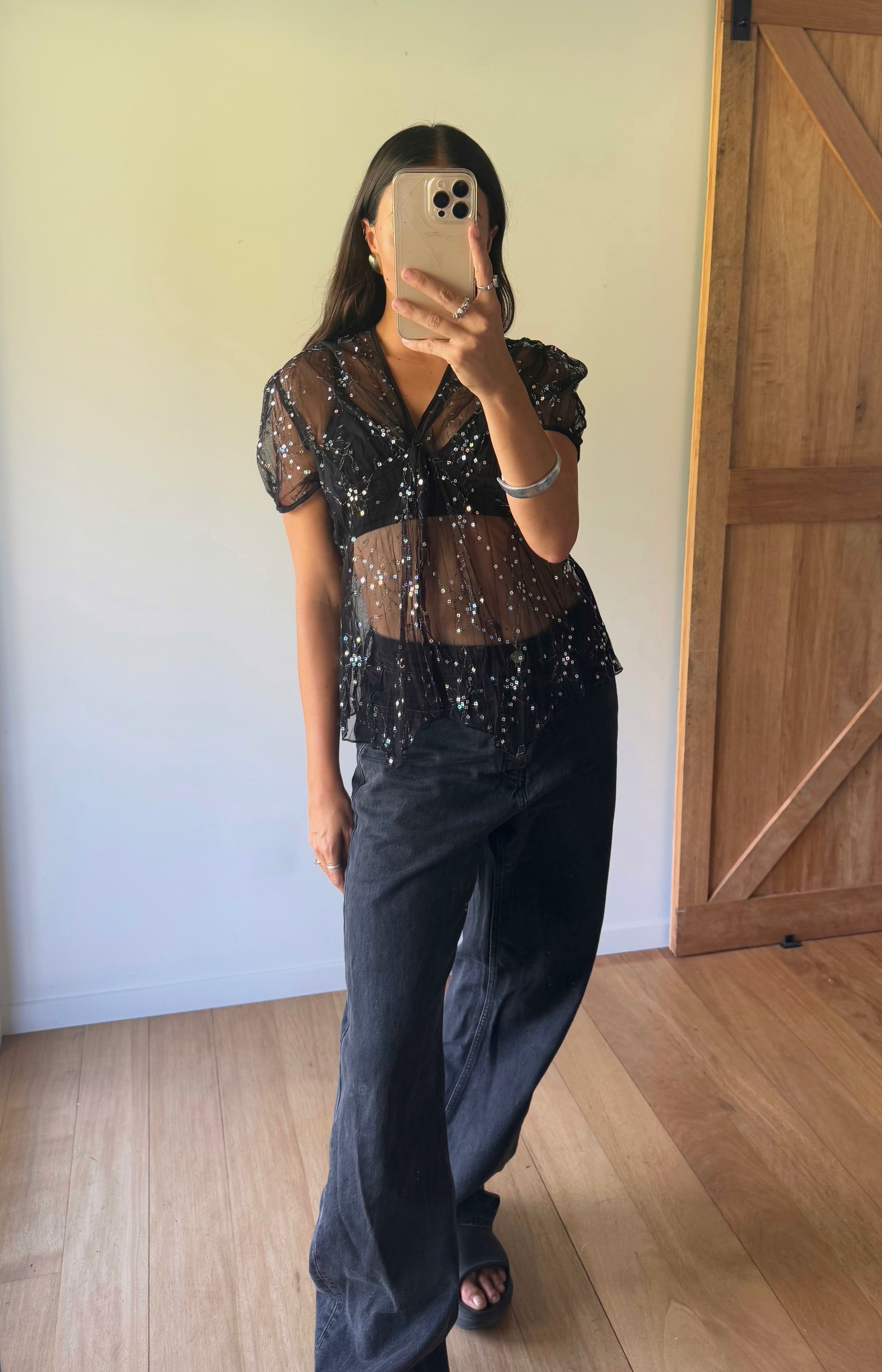 Sheer black top with sequin detail