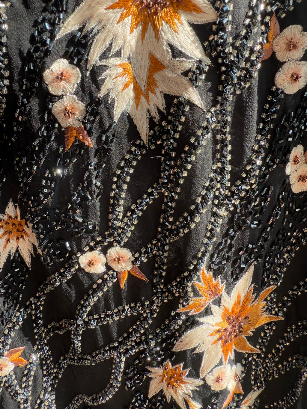Evening gown with sequins and hanky hem