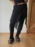 Y2K style sheer skirt over pants