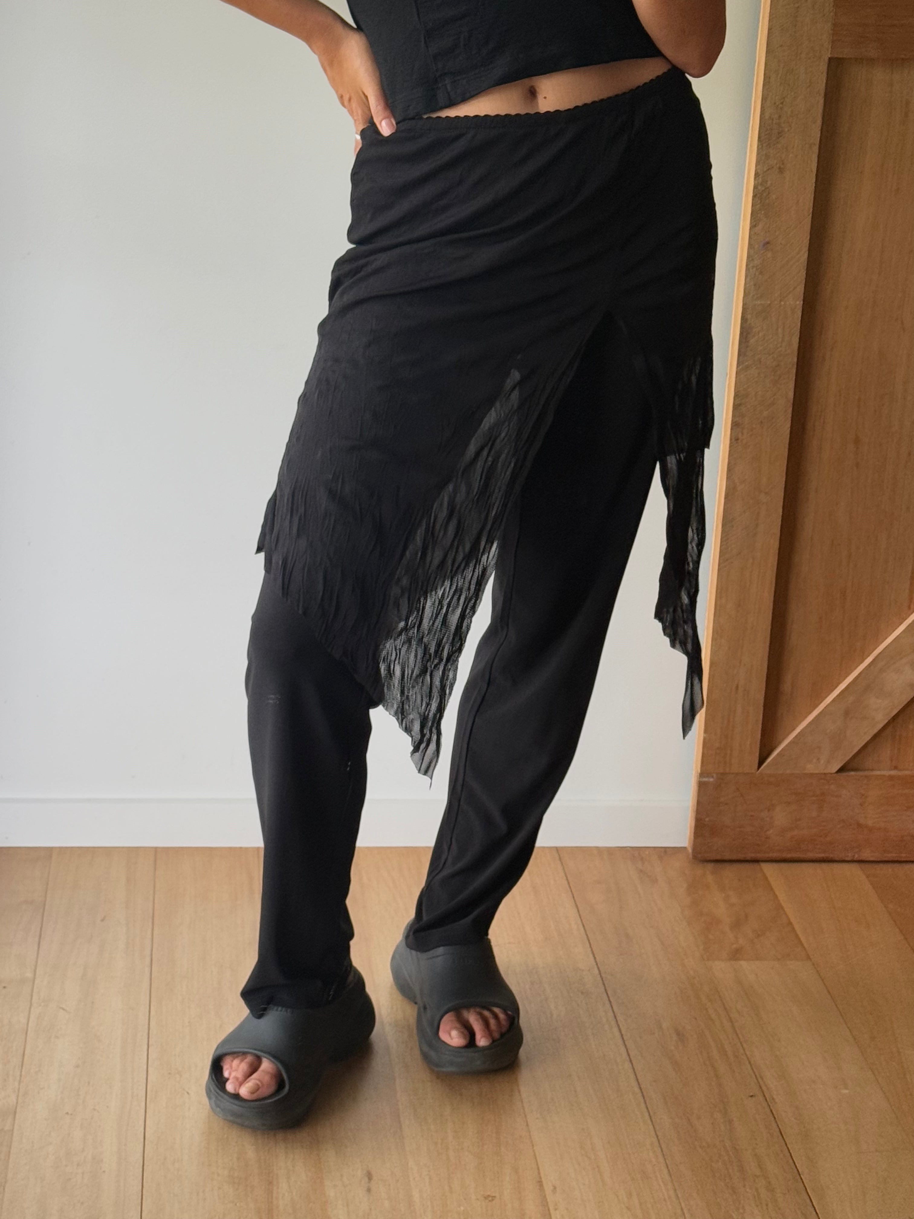 Y2K style sheer skirt over pants