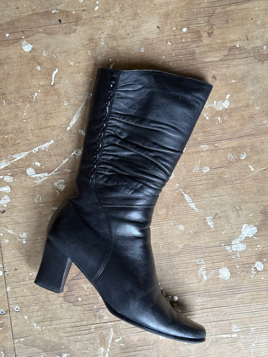 Black leather boots, mid-calf length