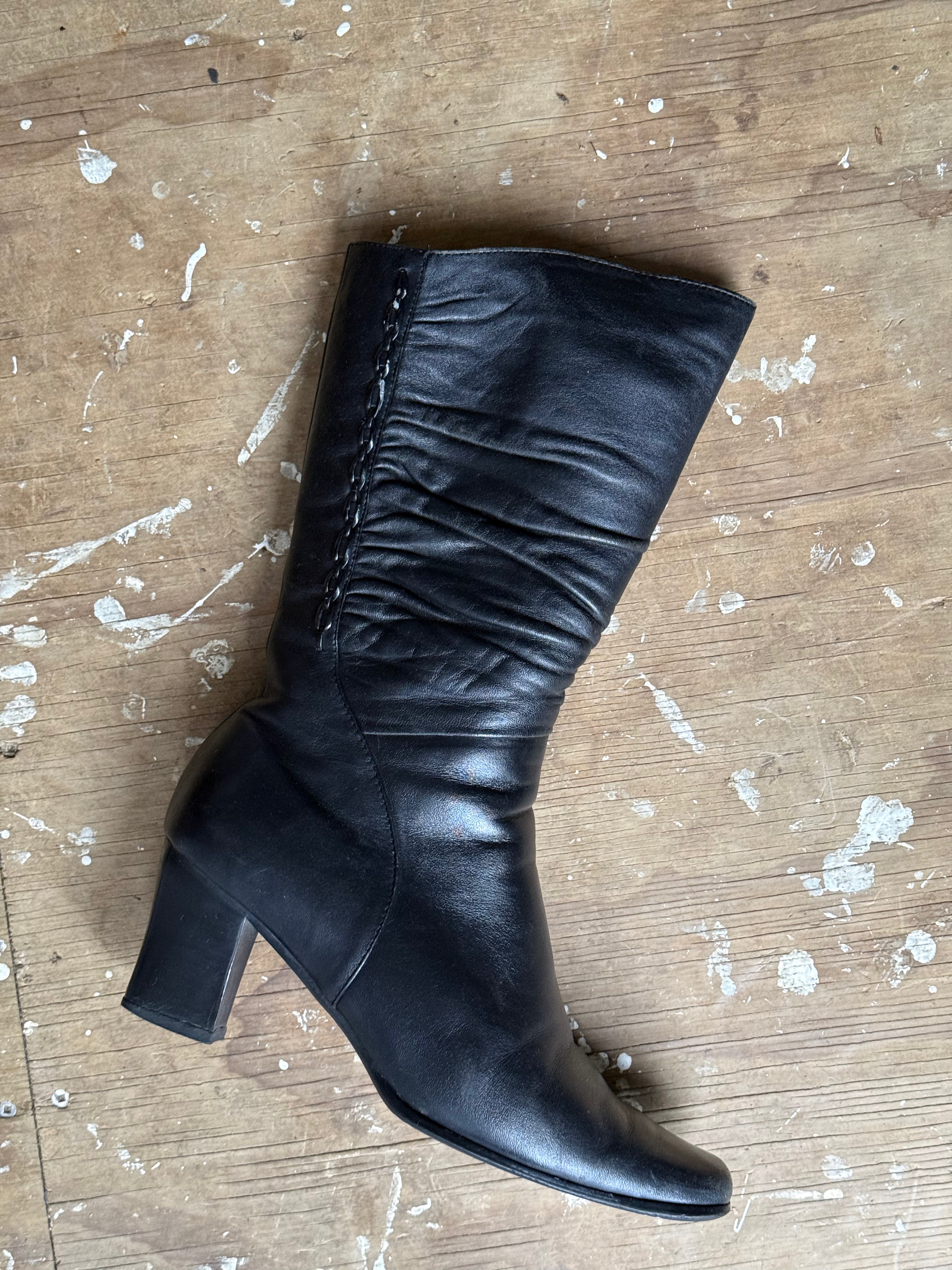 Black leather boots, mid-calf length
